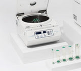 Laboratory centrifuge with samples on a white background, it is a great device purchase.