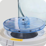 A compact and portable Meteor Handheld Centrifuge black and blue rotor and white body with some black components.