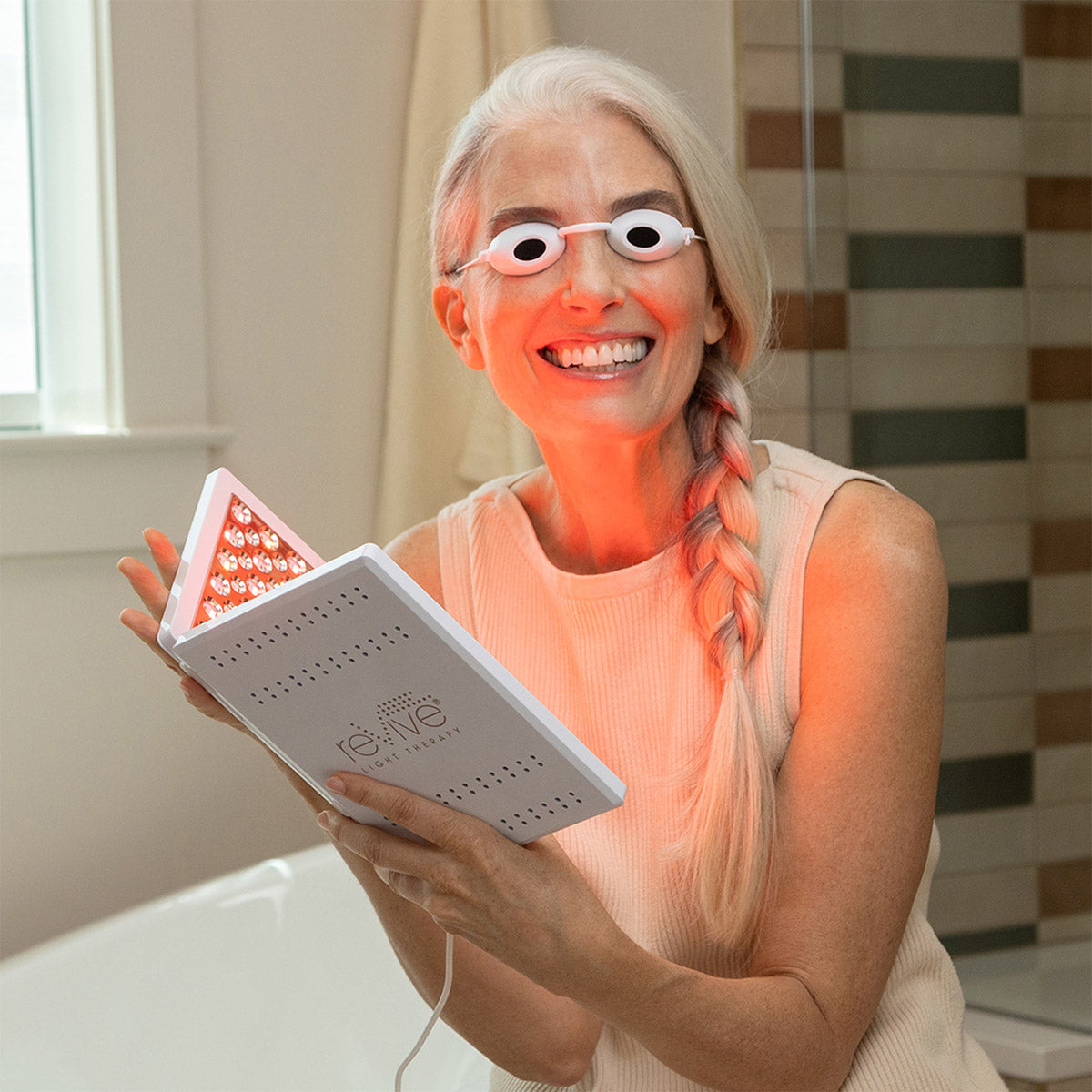 A lady getting LED treatment with proper eye safety mask. It is great red light device purchase.