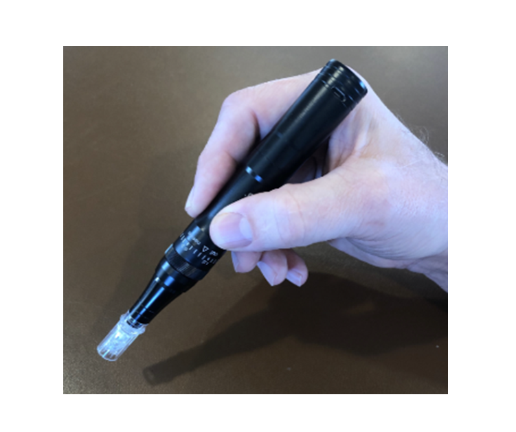 A close-up image of a hand holding a DermalPen Microneedling System device with a needle attached. It is an ideal value Microneedling device purchase.