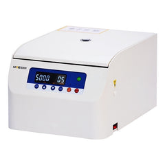 A white, low-speed centrifuge with a digital display and control buttons on the front panel. The brand MKE is visible on the top left corner.