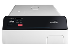 Silver medical device with black digital control top and 'midmark' branding.  It is an ideal value device purchase.