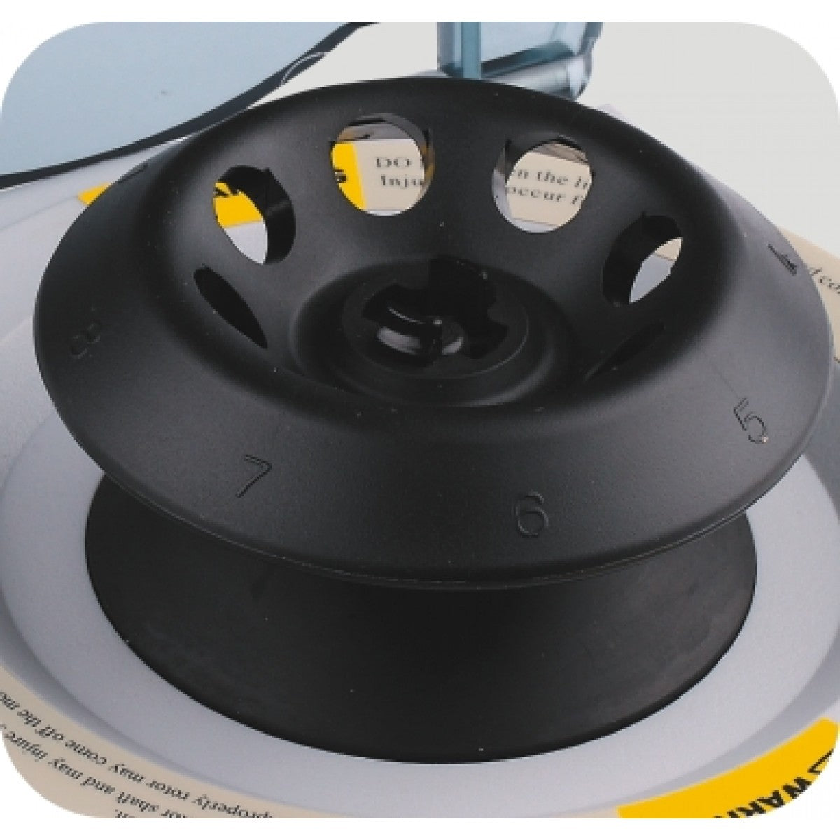 A compact and portable Meteor Handheld Centrifuge displaying the inside mechanism which includes a black rotor and white body with some black components.