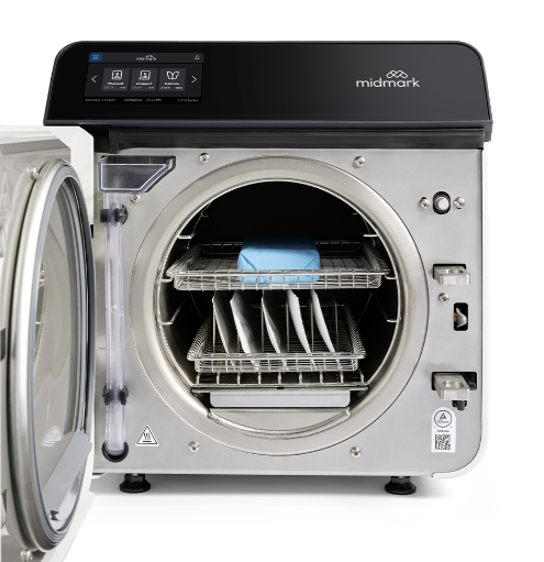 Midmark M9 Automatic Steam Sterilizer with the door open, displaying the internal rack for instruments, featuring a digital display and control panel on top.