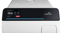 Midmark M9 Automatic Steam Sterilizer displaying a digital display and control panel on top.