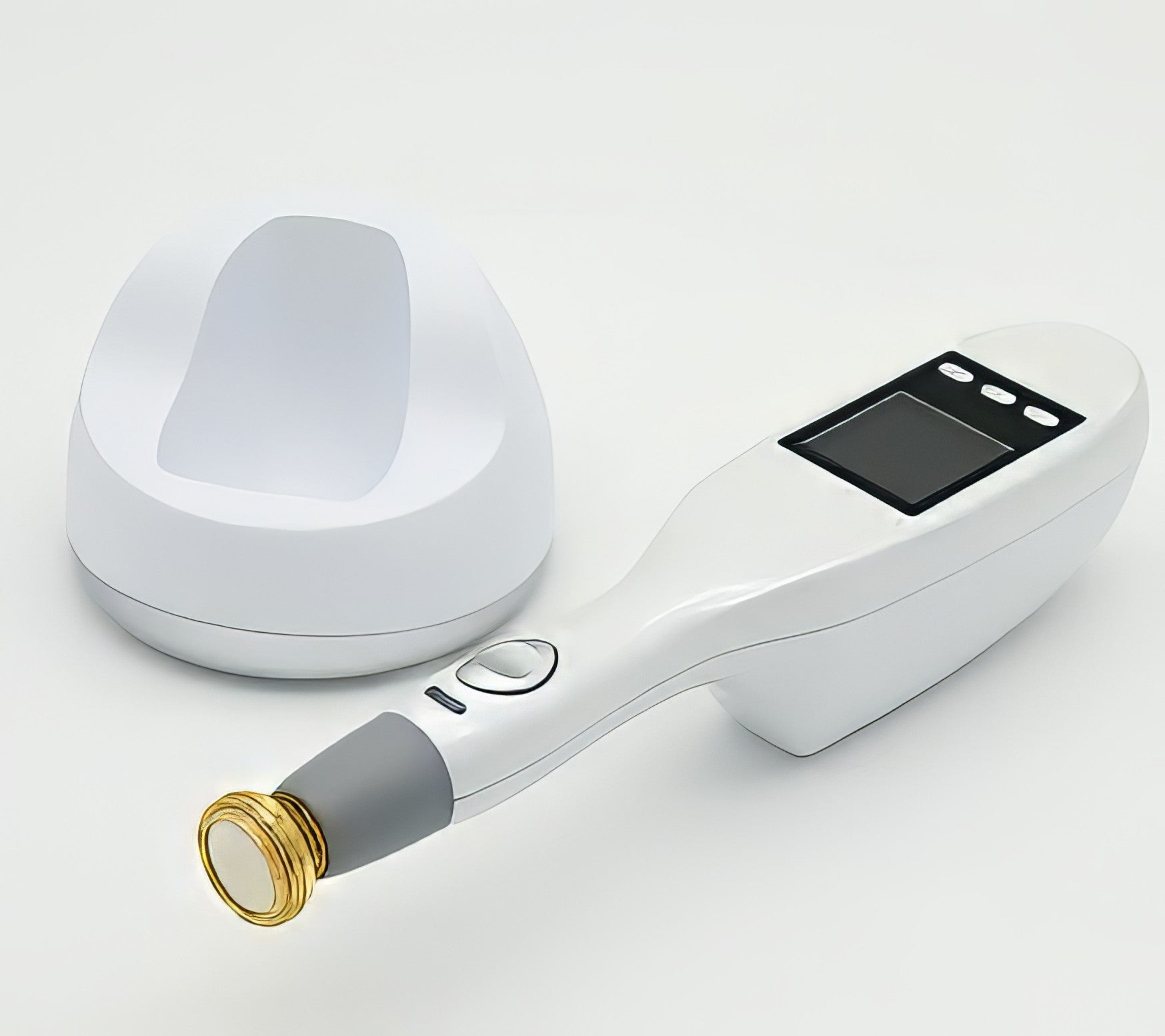 A handheld non-invasive plasma treatment device with a gold tip component lying on a surface. It is a great plasma device purchase.