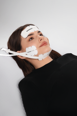 Woman wearing a WonderFace mask with visible branding, it is an ideal value for a laser device purchase.