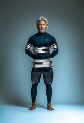 A man wearing a full-body suit with a medical device 'Wonder' around his abs, both arms and stomach. It is a great value EMF and RF laser purchase.