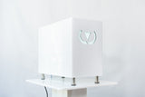 White Wonder Axon electronic device with a logo on a white background. It is a great value EMF and RF laser purchase.