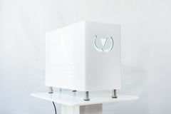 White Wonder Axon electronic device with a logo on a white background. It is a great value EMF and RF laser purchase.